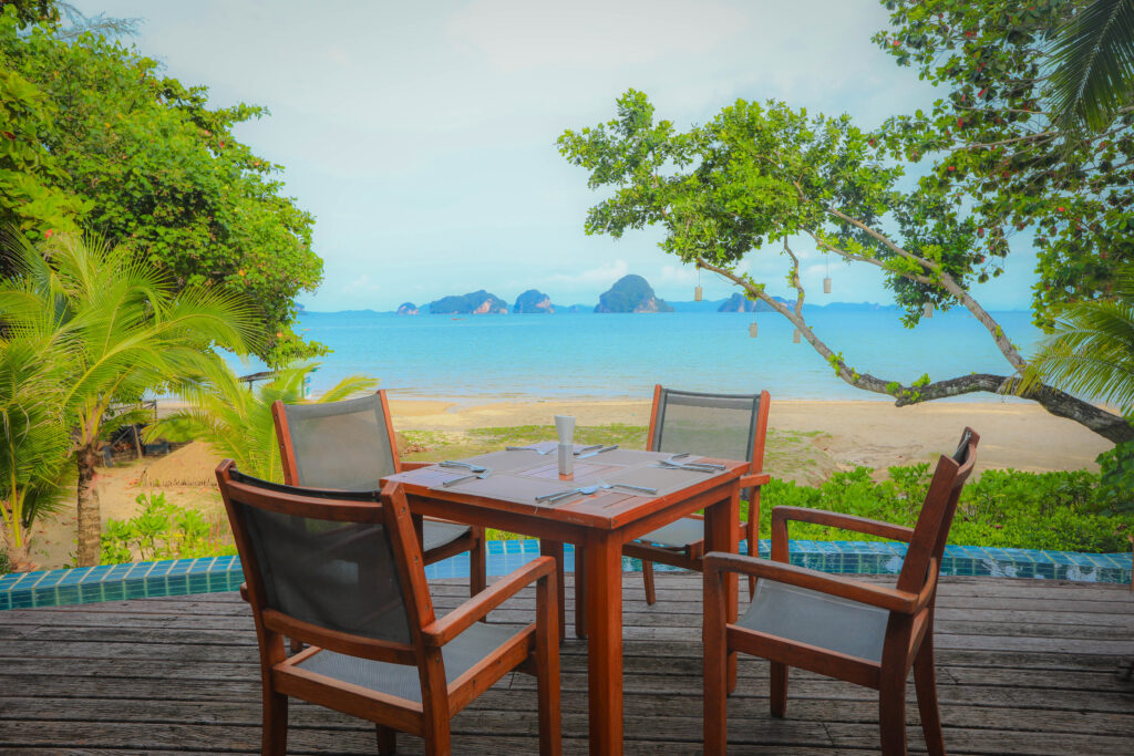 dining table and chairs on the tropical beach island on a summer day